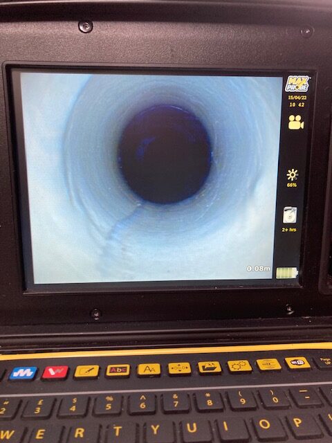 Successful drain pipe patch repair inspection showing seamless interior lining after trenchless rehabilitation